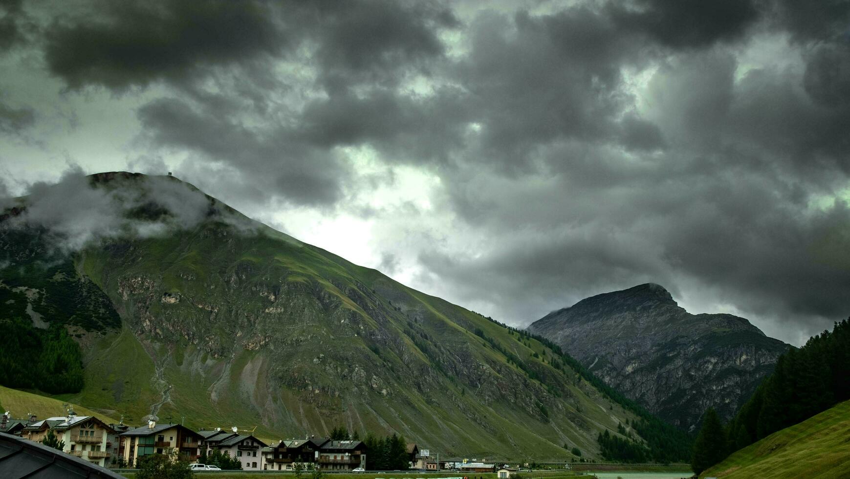 panorama of the town of Livigno, a mountain village in Valtellina on the border with Switzerland in July, summer 2023 photo