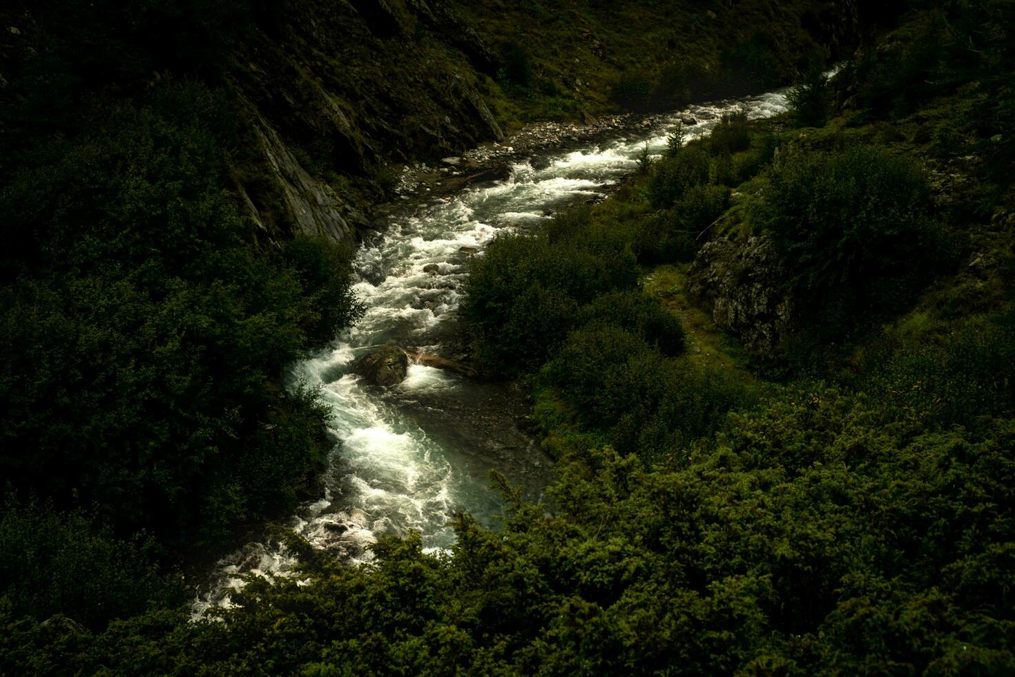 spectacular mountain landscapes of waterfalls and streams in Livigno in Valtellina on the border with Switzerland, in the summer of 2023 photo