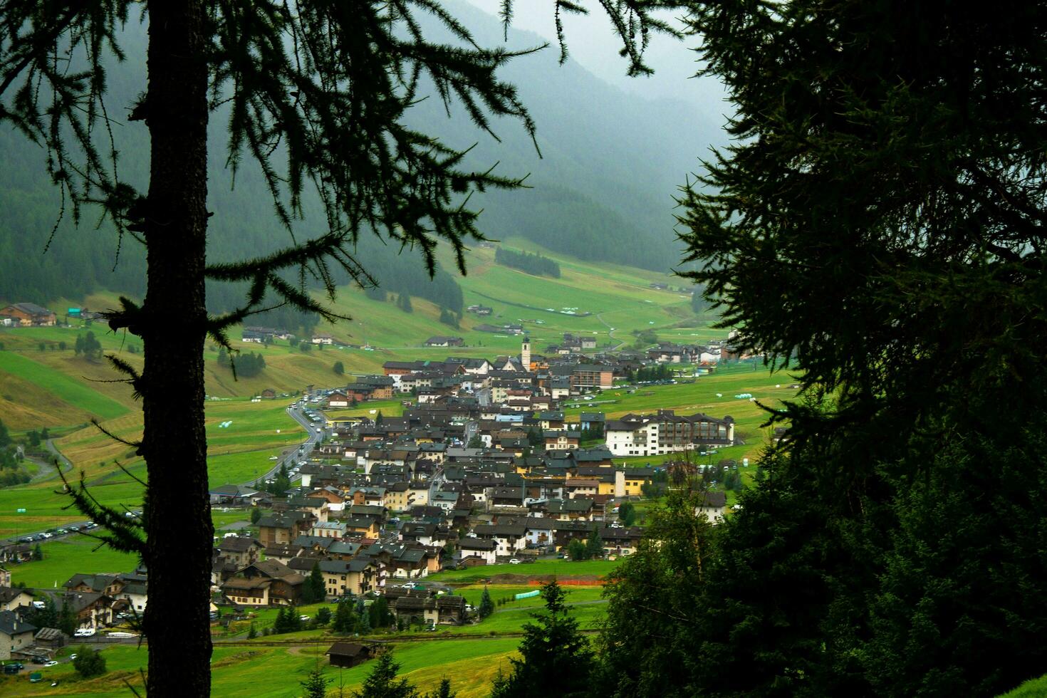 panorama of the town of Livigno, a mountain village in Valtellina on the border with Switzerland in July, summer 2023 photo