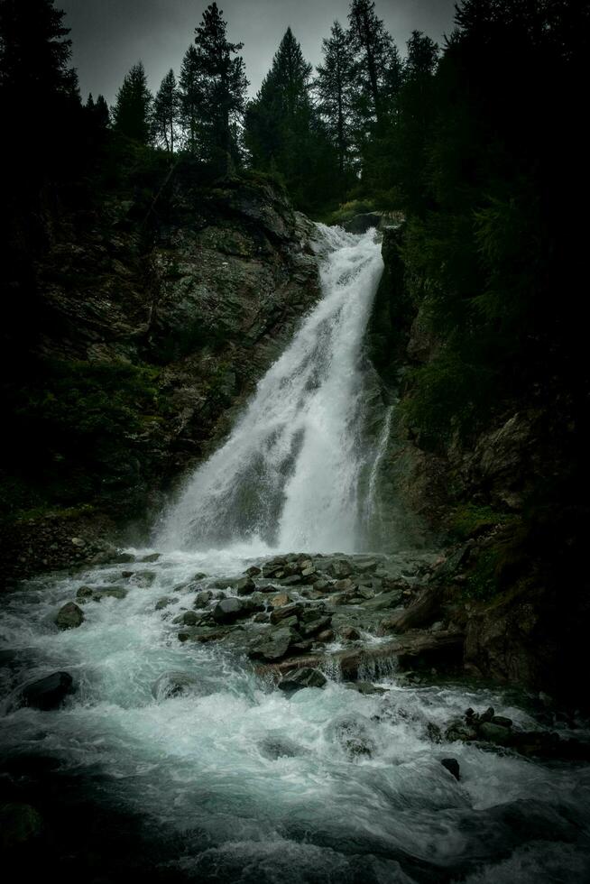 spectacular mountain landscapes of waterfalls and streams in Livigno in Valtellina on the border with Switzerland, in the summer of 2023 photo