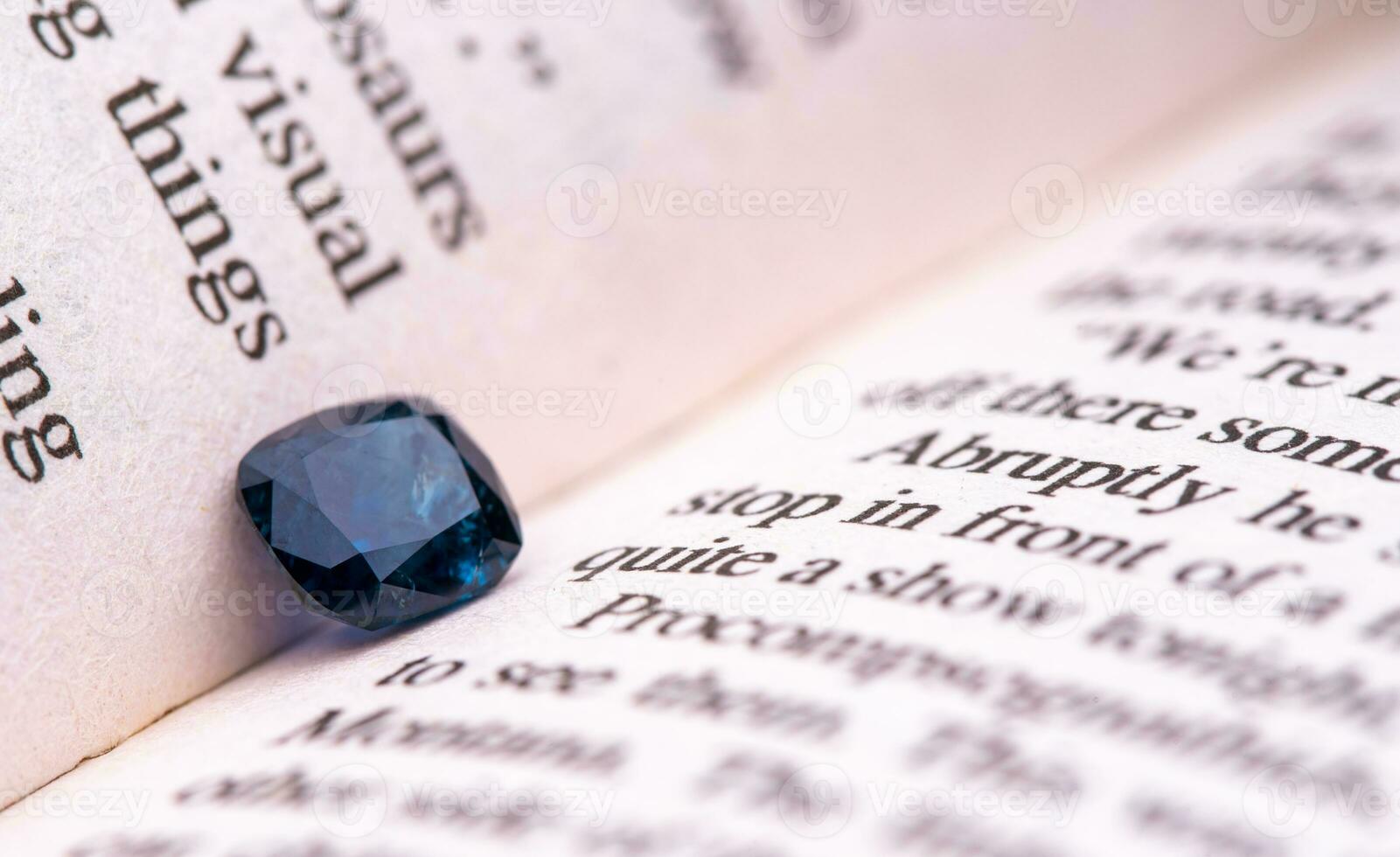 Sapphire gemstone on book photo