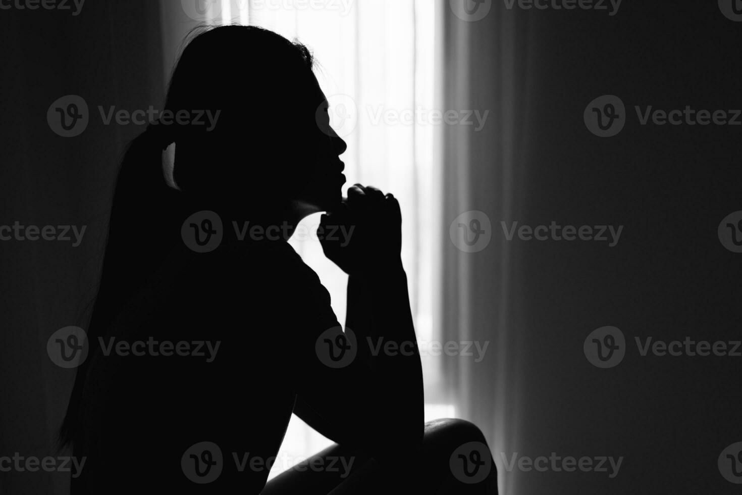 Silhouette of Religious young woman praying to God in the morning, spirtuality and religion,  Christians and Bible study concept. photo