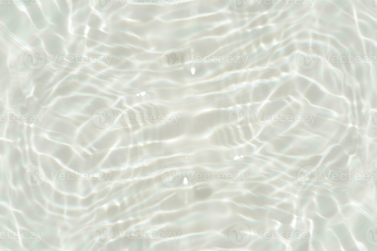 Blue water with ripples on the surface. Defocus blurred transparent blue colored clear calm water surface texture with splashes and bubbles. Water waves with shining pattern texture background. photo