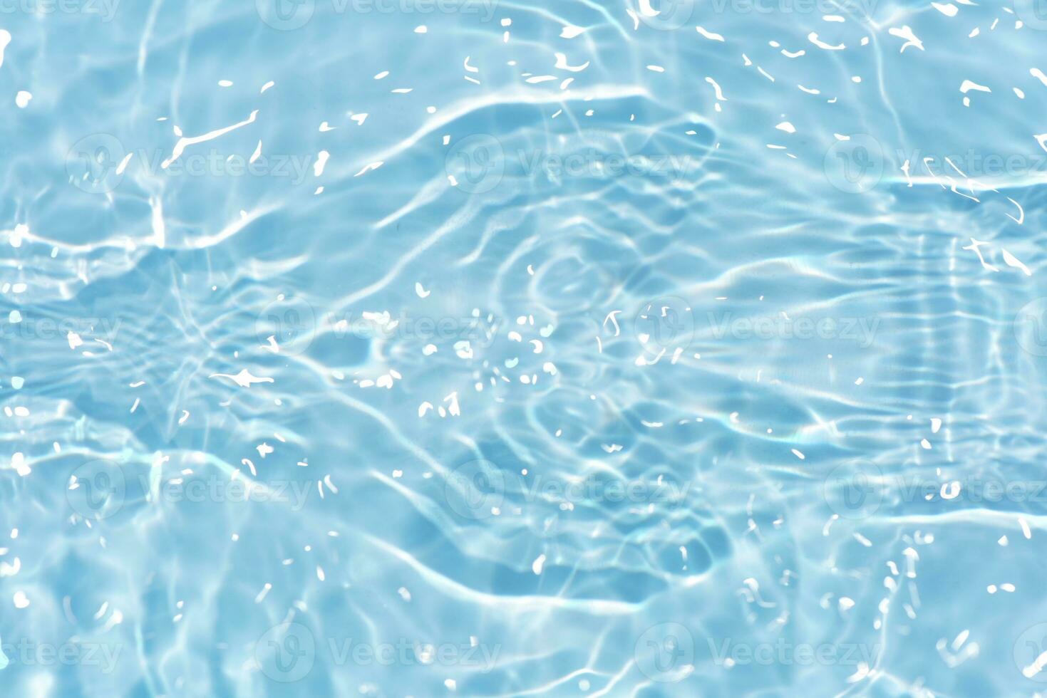 Defocus blurred transparent white colored clear calm water surface texture with splashes reflection. Trendy abstract nature background. Water waves in sunlight with copy space. Blue watercolor shine. photo