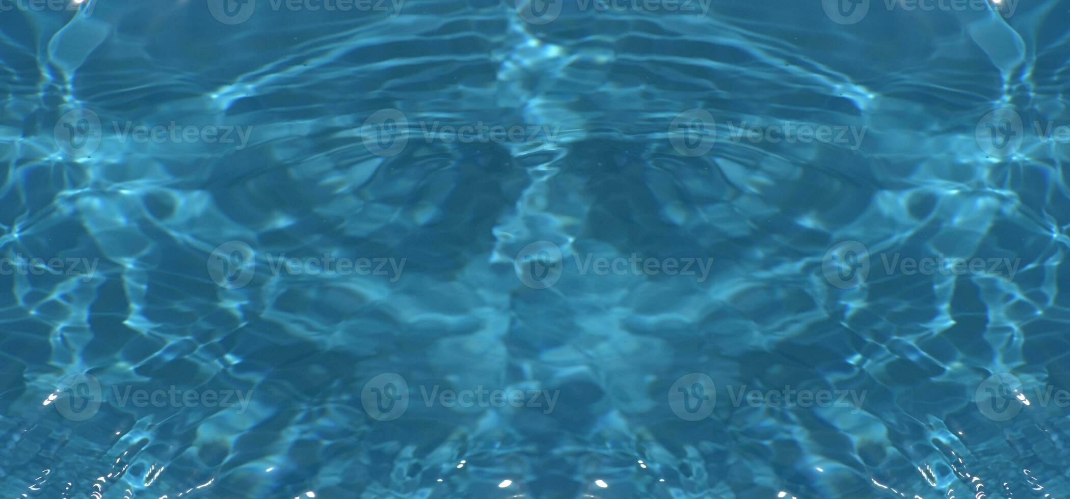 Defocus blurred transparent blue colored clear calm water surface texture with splashes reflection. Trendy abstract nature background. Water waves in sunlight with copy space. Blue watercolor shine. photo