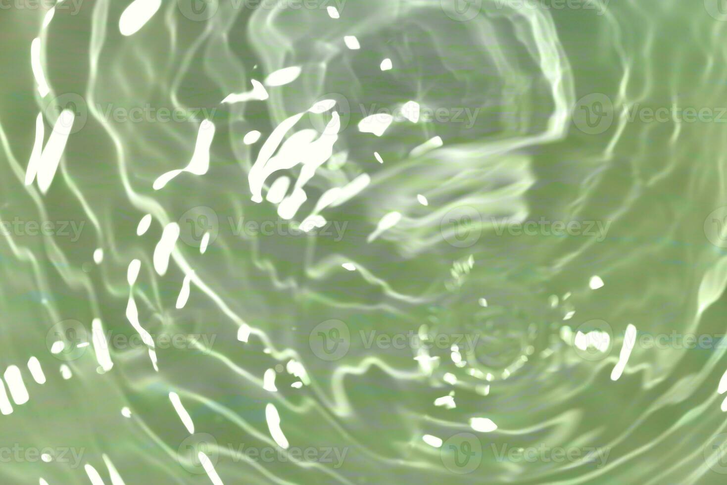 Defocus blurred transparent blue colored clear calm water surface texture with splashes reflection. Trendy abstract nature background. Water waves in sunlight with copy space. Blue watercolor shine. photo