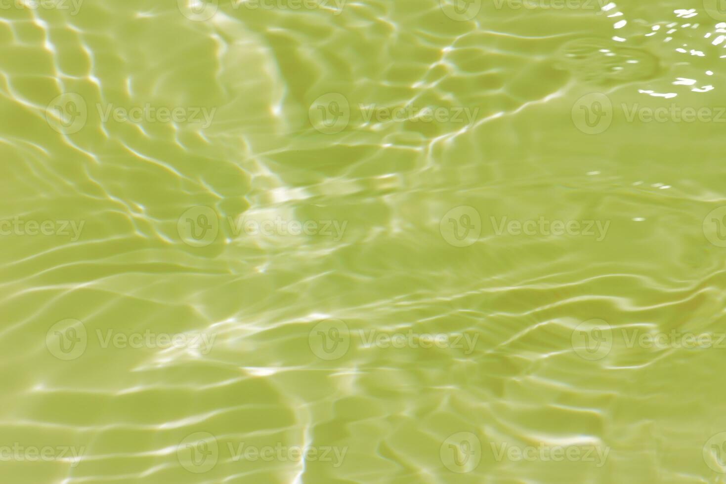 Defocus blurred transparent blue colored clear calm water surface texture with splashes reflection. Trendy abstract nature background. Water waves in sunlight with copy space. Blue watercolor shine. photo
