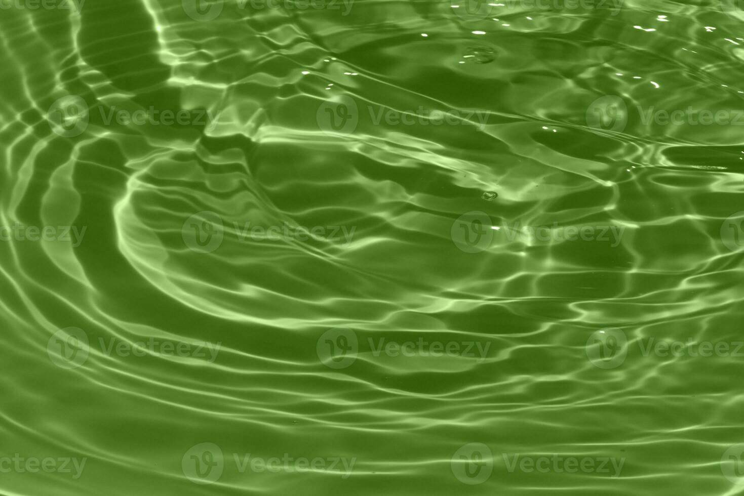 Defocus blurred transparent blue colored clear calm water surface texture with splashes reflection. Trendy abstract nature background. Water waves in sunlight with copy space. Blue watercolor shine. photo