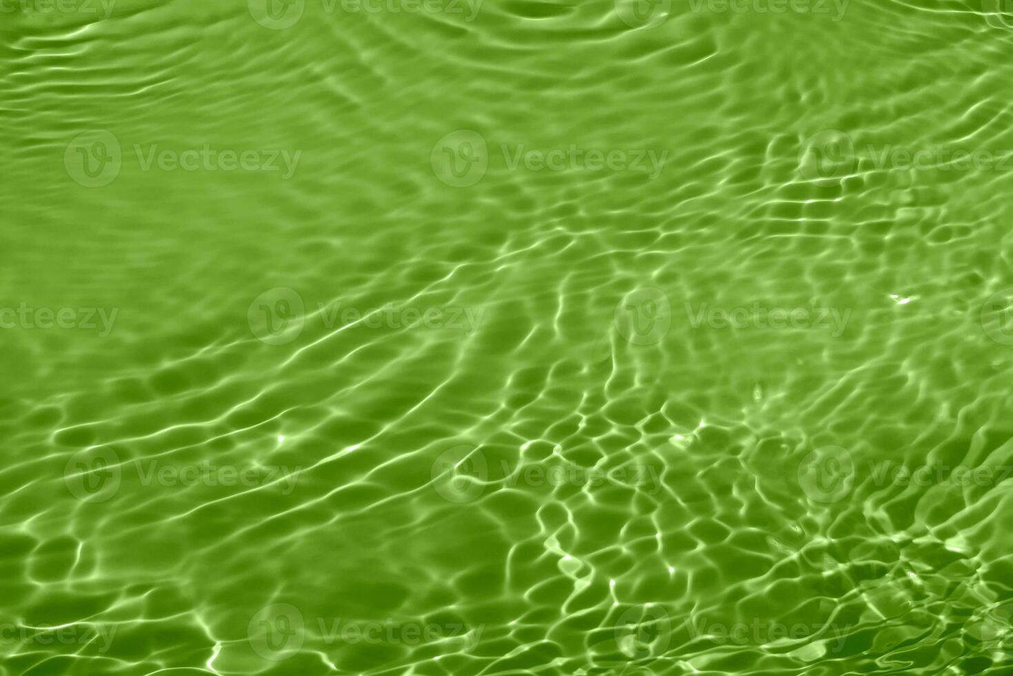 Defocus blurred transparent blue colored clear calm water surface texture with splashes reflection. Trendy abstract nature background. Water waves in sunlight with copy space. Blue watercolor shine. photo