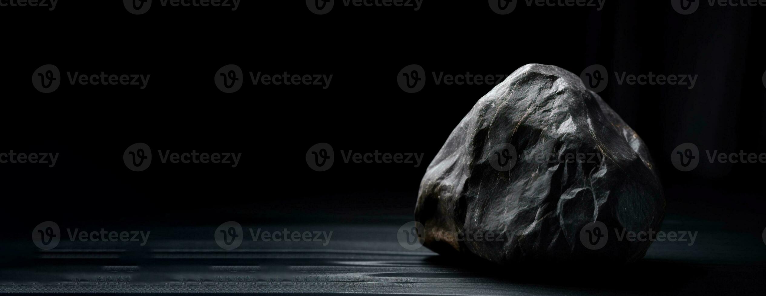 Musgravite is a rare precious natural geological stone on a black background in low key. AI generated. photo