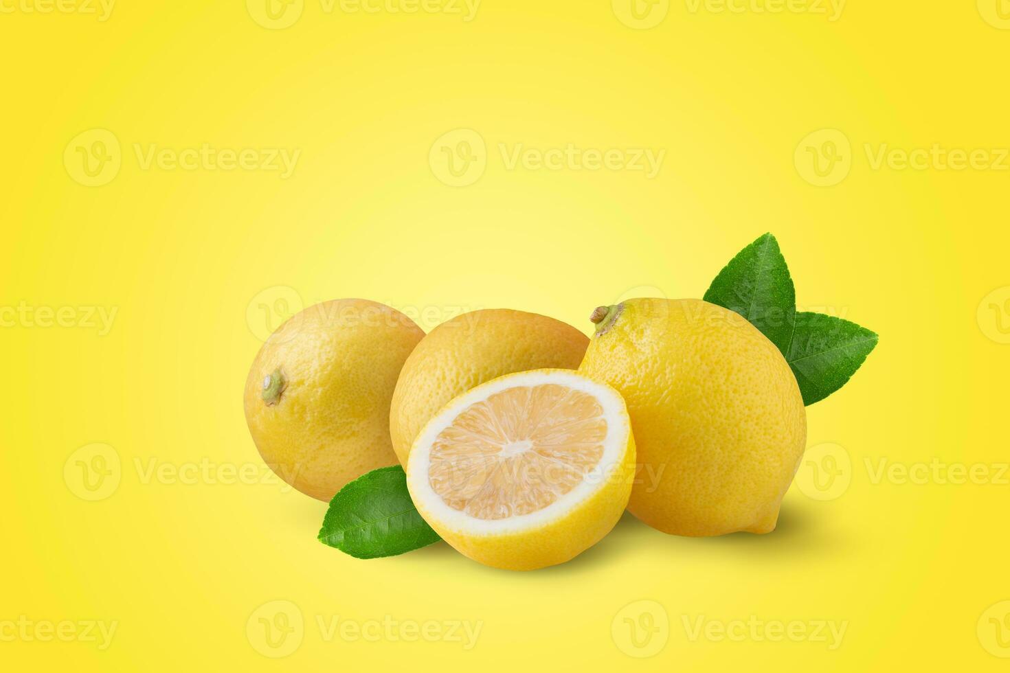 yellow lemon with leaves isolated on a yellow background. photo