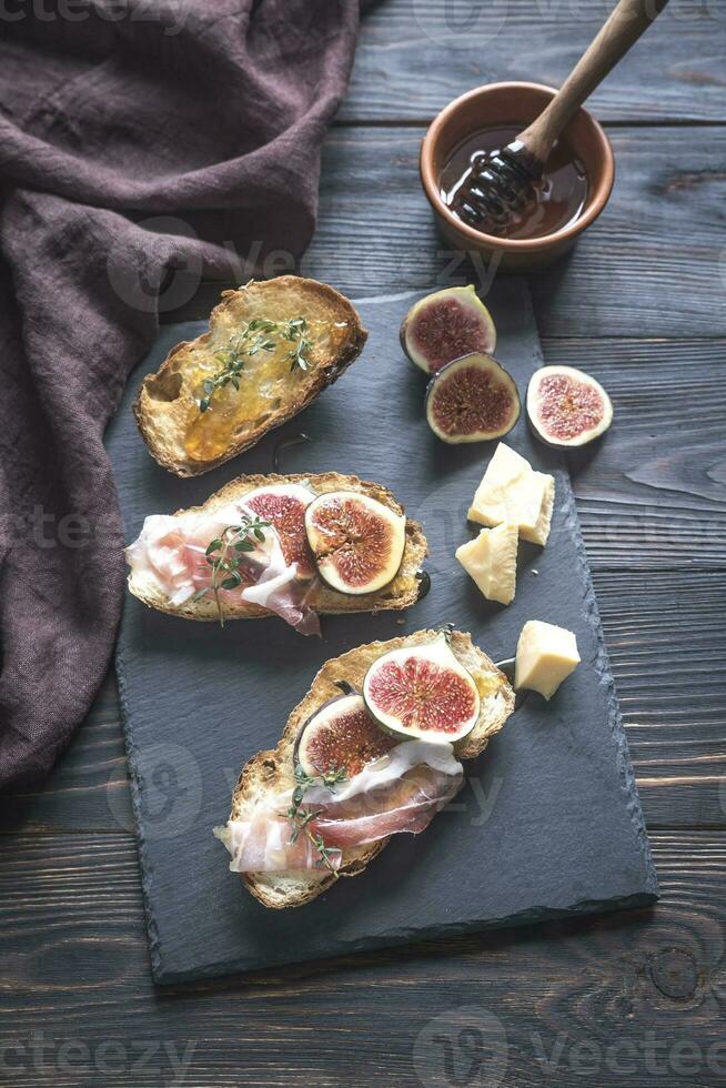 Toasts with bacon and figs photo