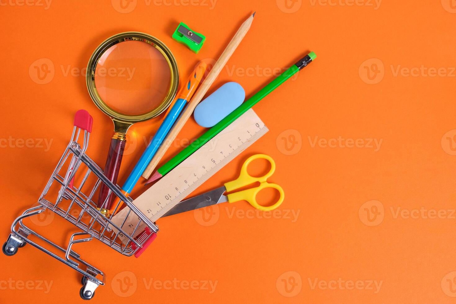 Shopping basket with office and school supplies.Concept preparing for