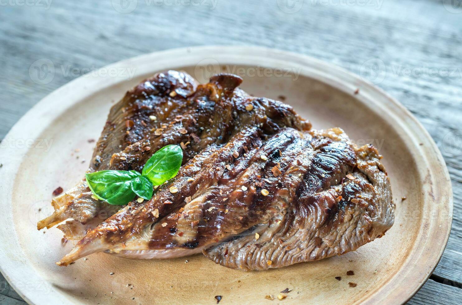 Grilled turkey on the wooden board photo