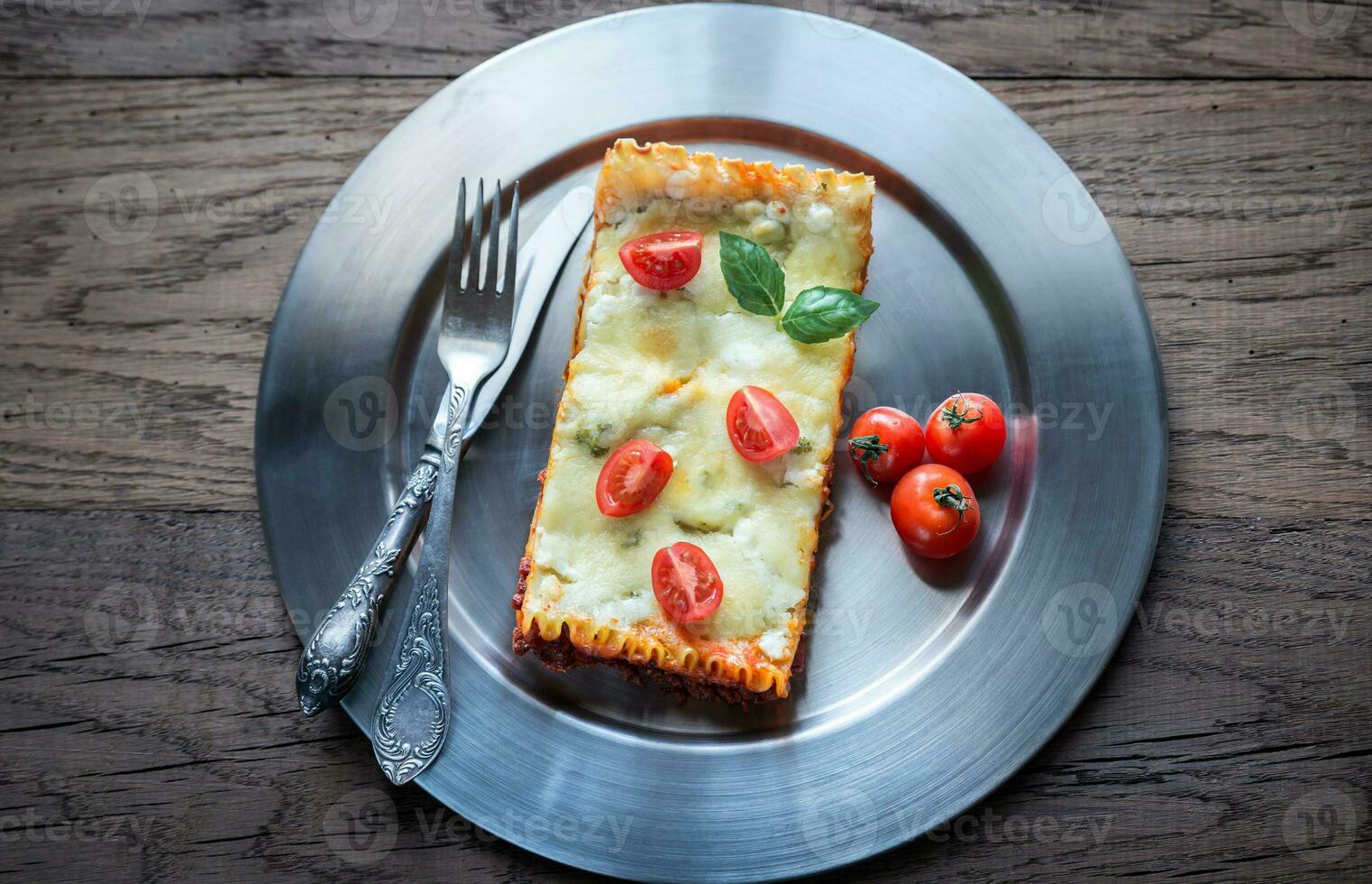 Lasagna on the metal plate photo