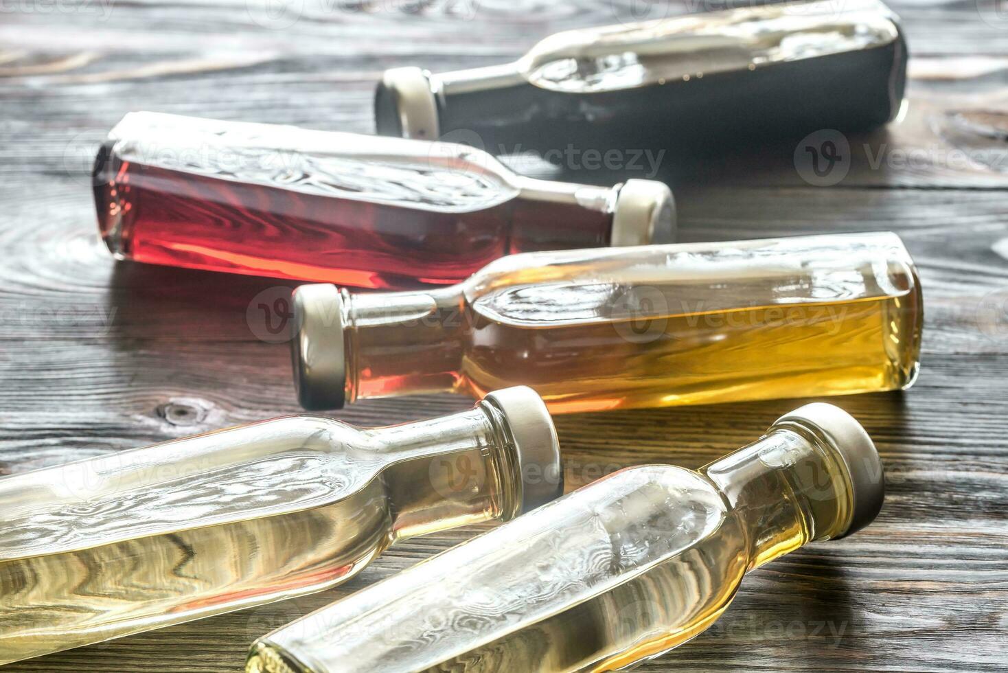 Bottles with different kinds of vinegar photo