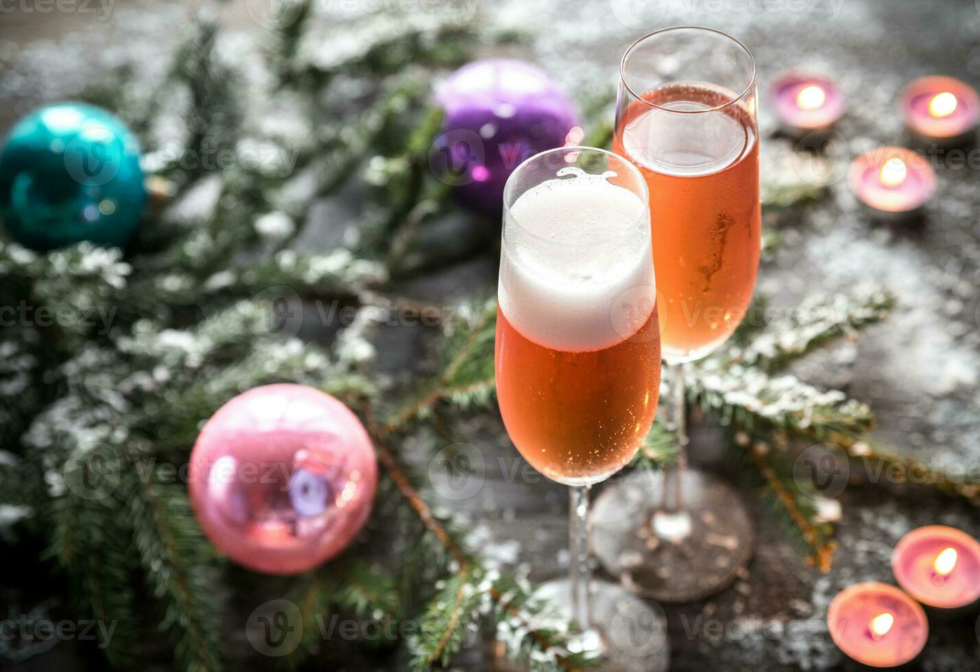 Two glasses of champagne with Christmas tree branch photo