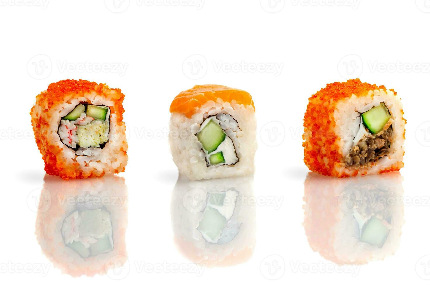 Set of three sushi rolls on a white plate with reflection. Sushi roll with rice, tofu cheese, flying fish roe, crab meat and avocado, salmon. Sushi menu. Japanese and Asian cuisine, restaurant. photo