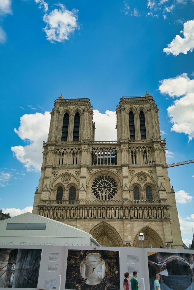 France, Paris, 20.08.2023 Notre-Dame de Paris, referred to simply as Notre-Dame, is a medieval Catholic cathedral, The cathedral, dedicated to the Virgin Mary, finest French Gothic architecture photo