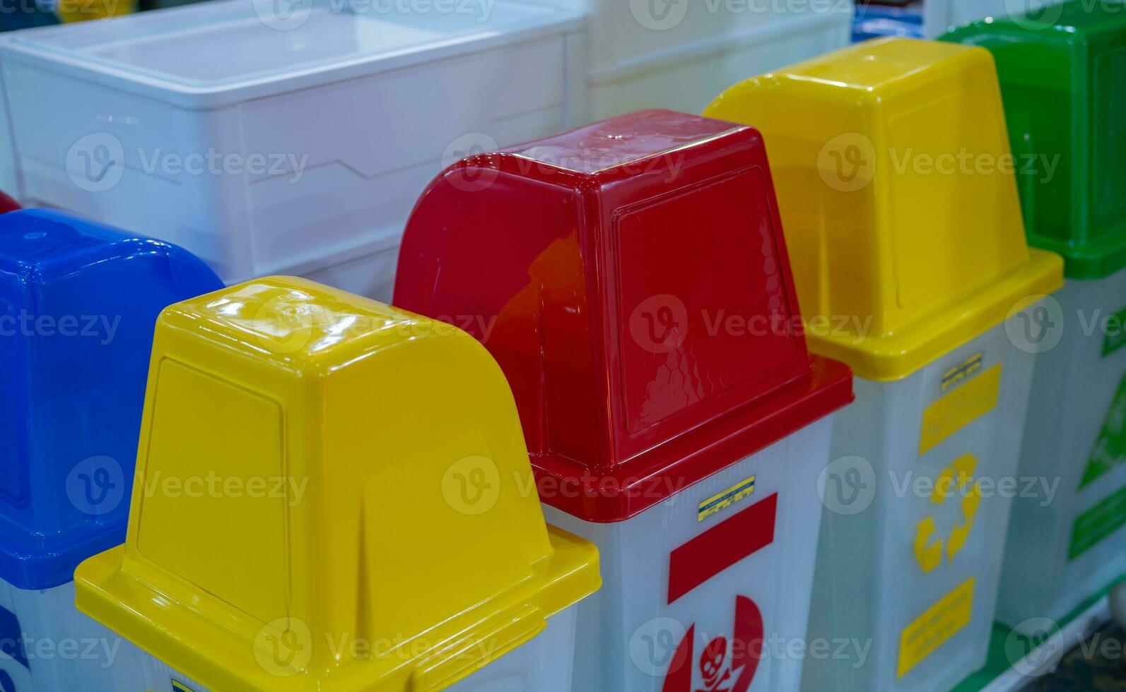 Trash can supplier. Plastic recycling bins for Eco-friendly waste management. Blue, red, yellow, and green bins for sustainable disposal. Plastic trash can distributor. Container for sorting waste. photo