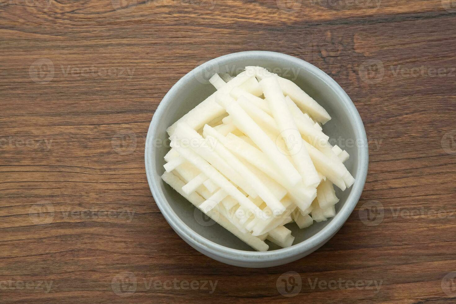 A bowl of fresh jicama or bengkoang, Jicama slices, gut health. photo