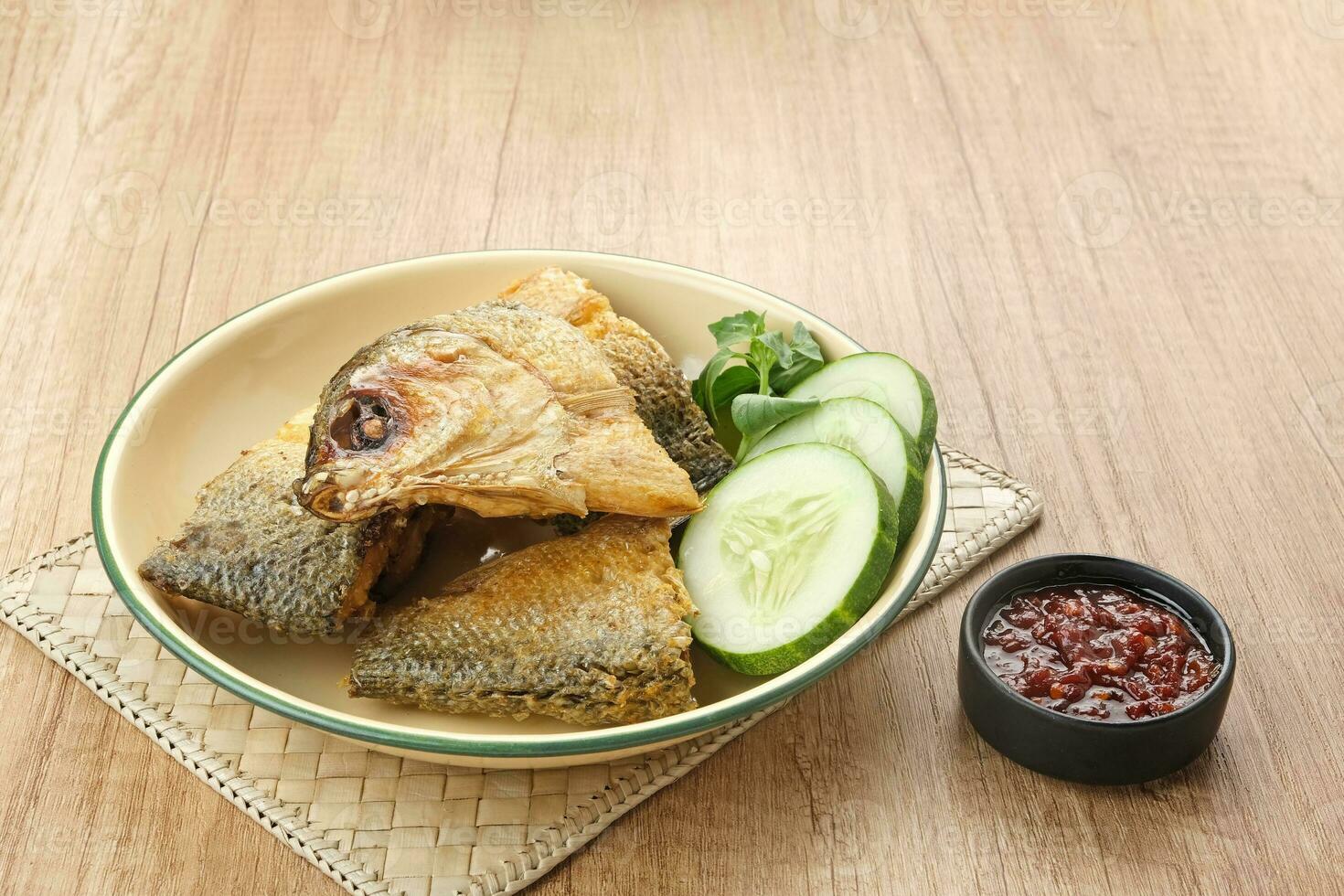 Bandeng Presto or Milkfish with high pressure cooked, served with chilli sauce, Indonesian food photo