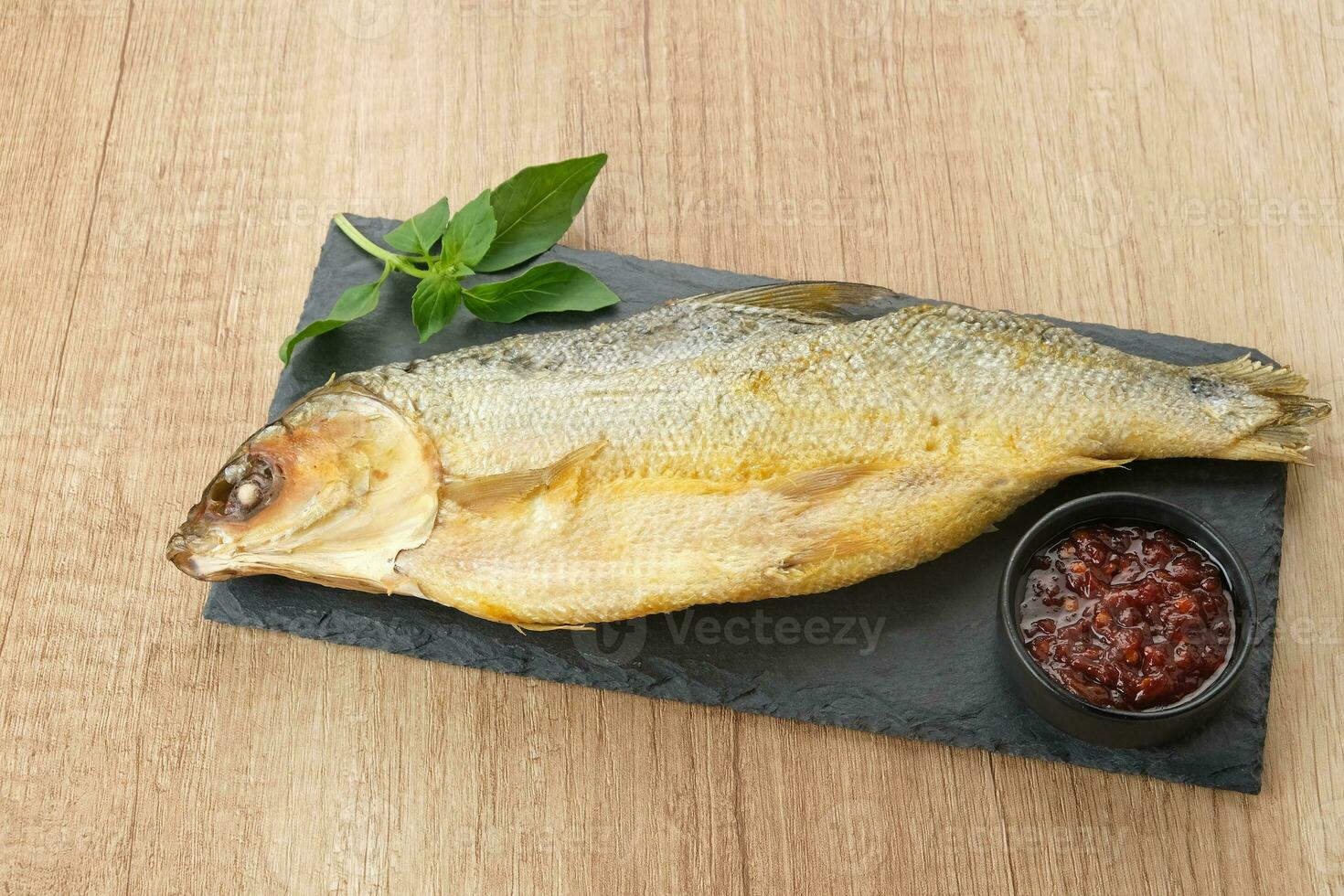 Bandeng Presto or Milkfish with high pressure cooked, served with chilli sauce, Indonesian food photo