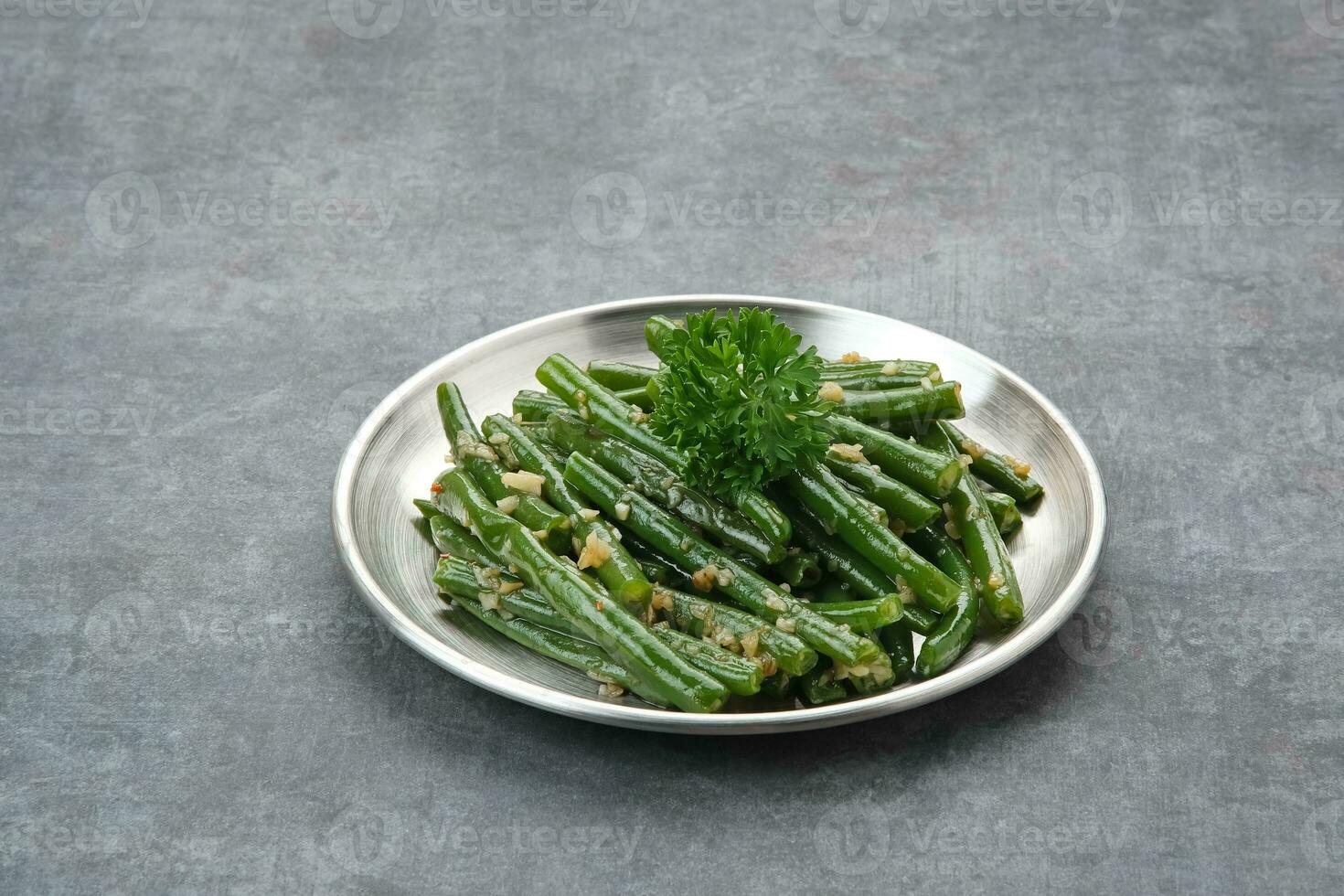 Tumis Buncis or Stir Fry String Bean with garlic and chilli powder photo