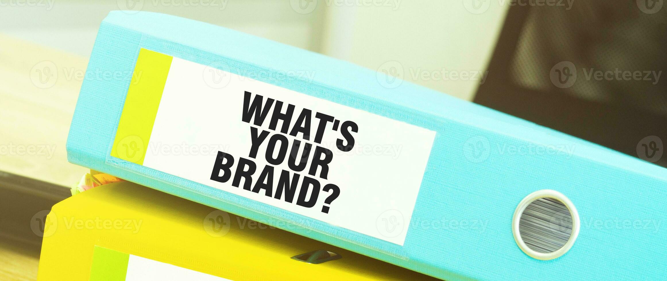 Two office folders with text WHAT's your brand photo