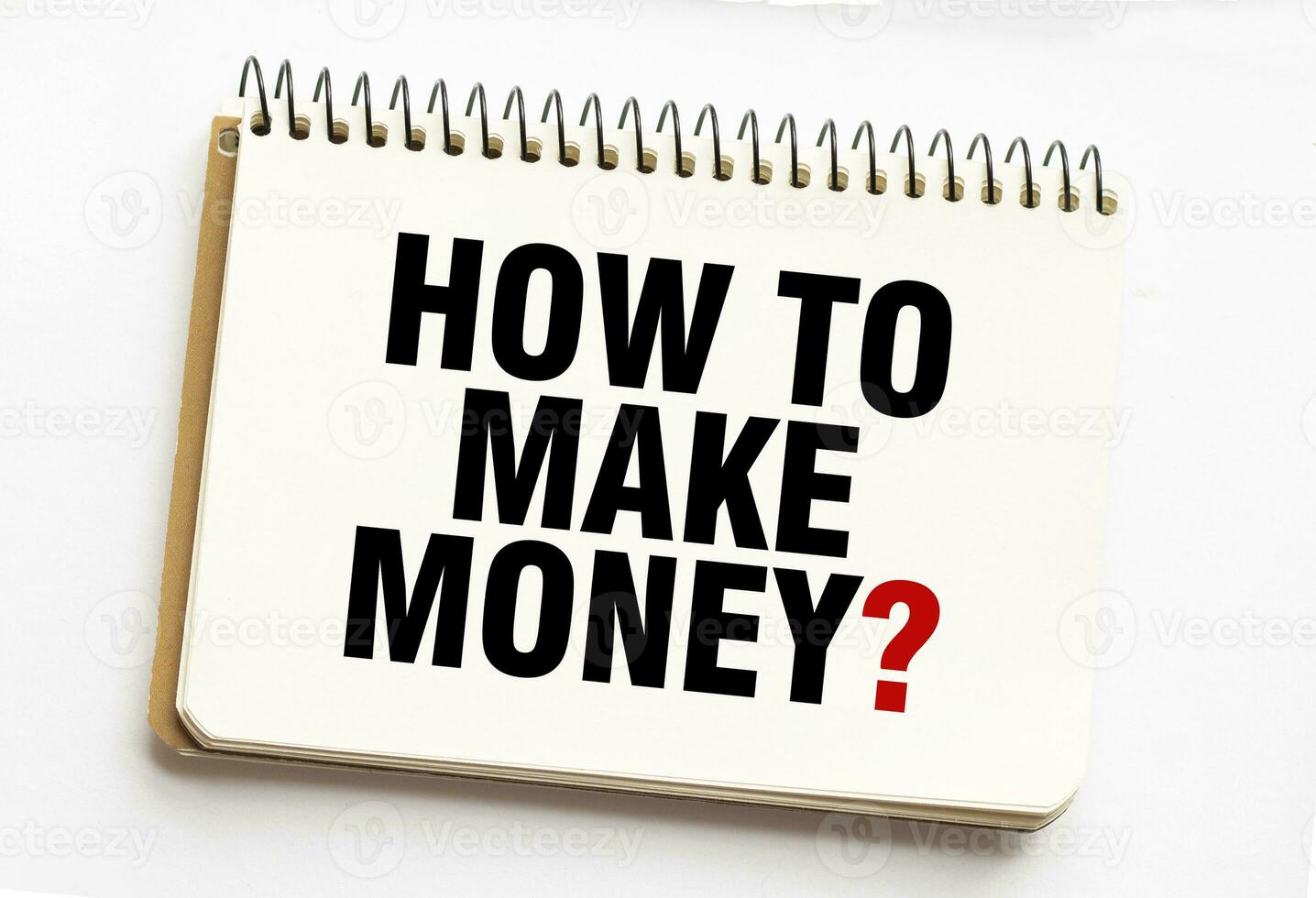 HOW TO MAKE MONEY on notepad with white background photo