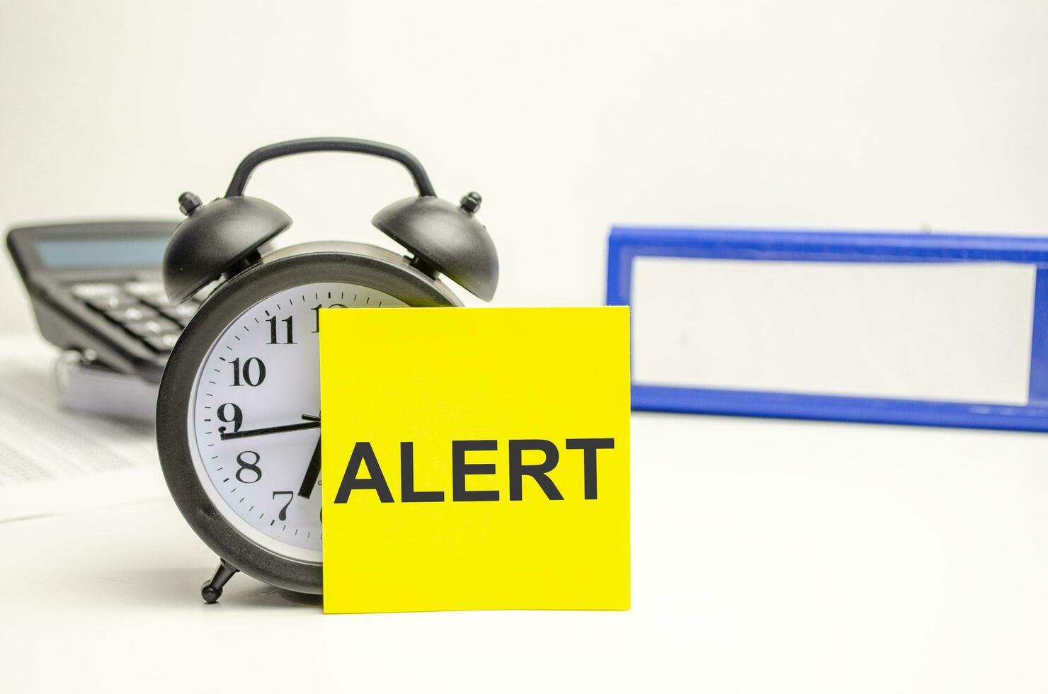 Retro alarm clock and the text alert word photo