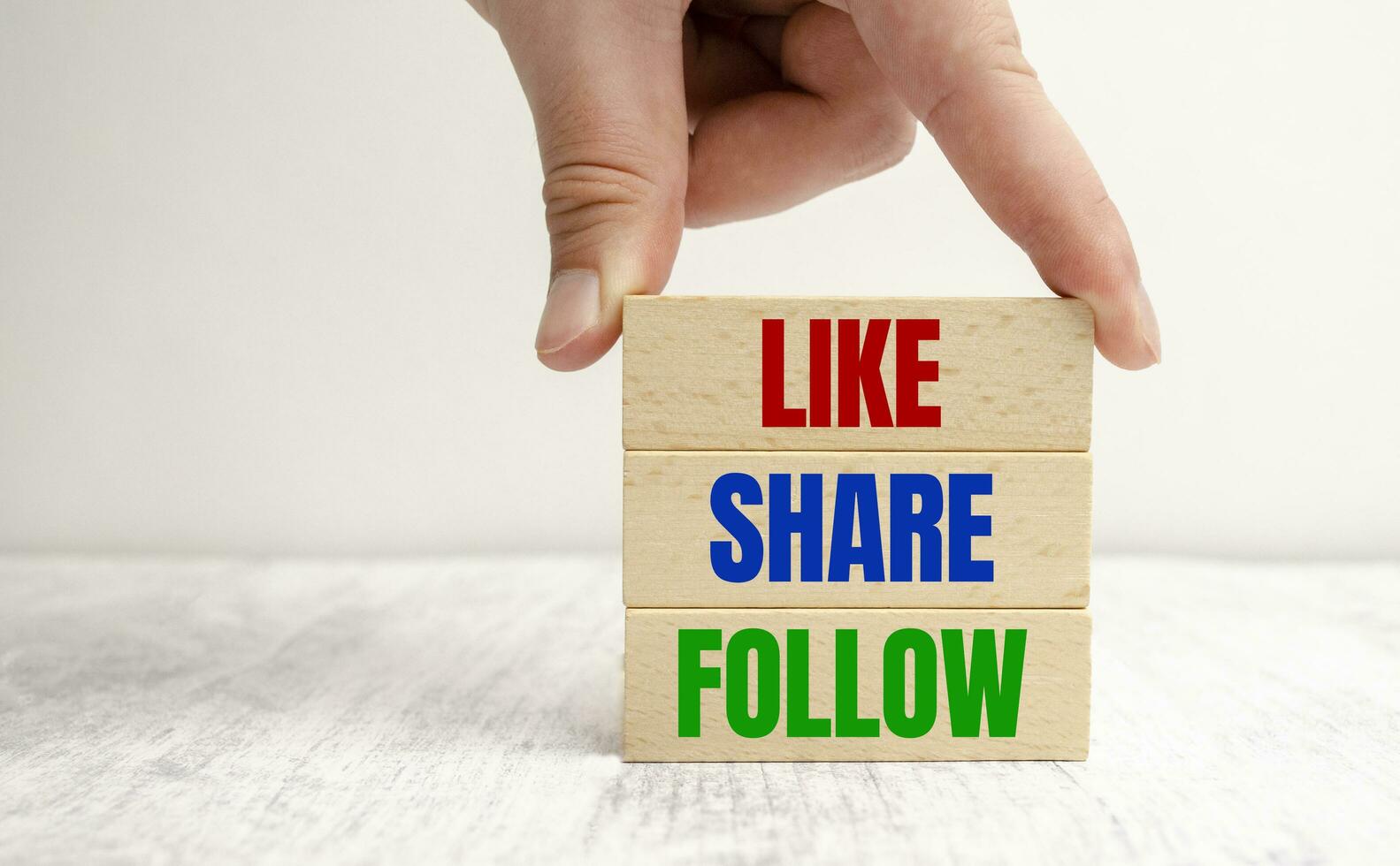 Share, like and follow. Social media marketing concept photo