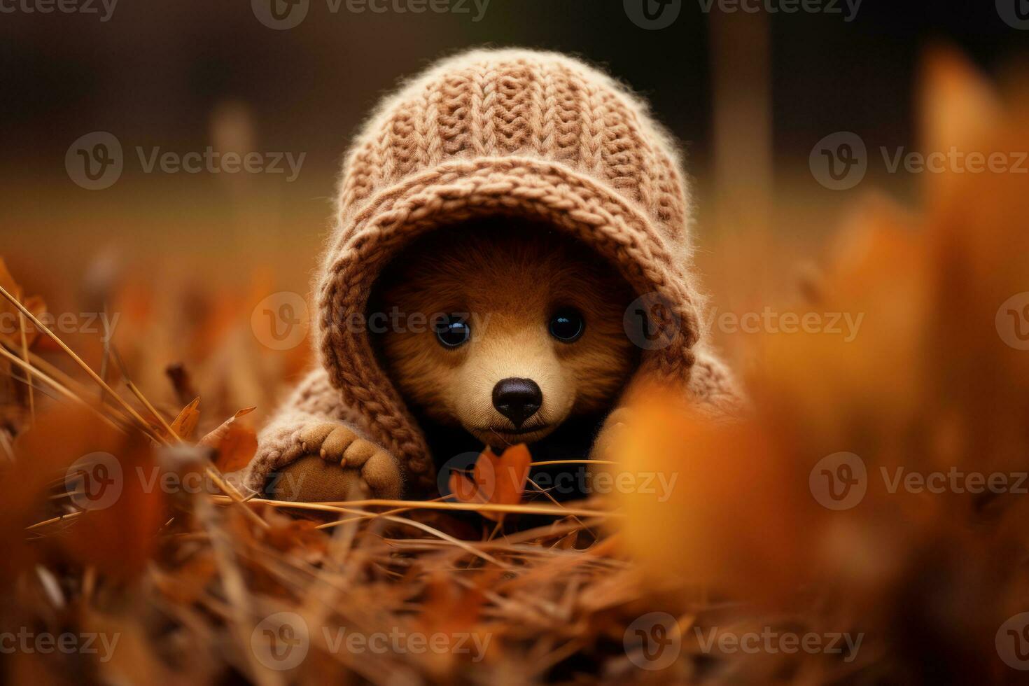 a teddy bear wearing a knitted hat in the autumn leaves generative ai photo