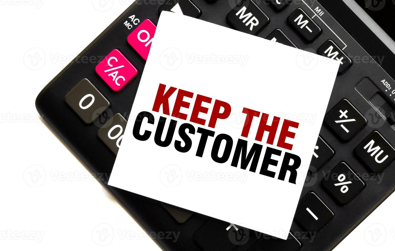 KEEP THE CUSTOMER on white sticker with calculator on white sticker with calculator photo
