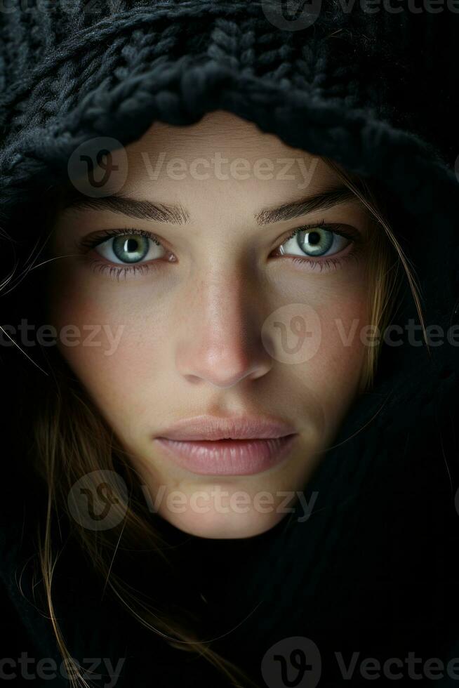 a woman with green eyes in a black hoodie generative ai photo