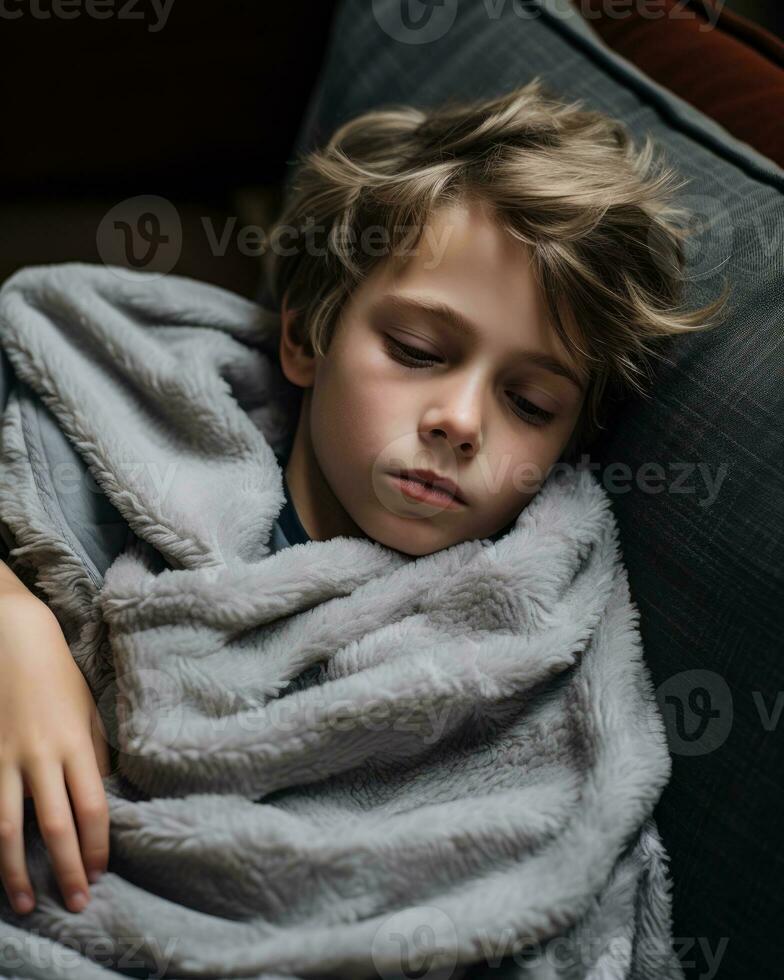 a young boy is wrapped up in a blanket generative ai photo
