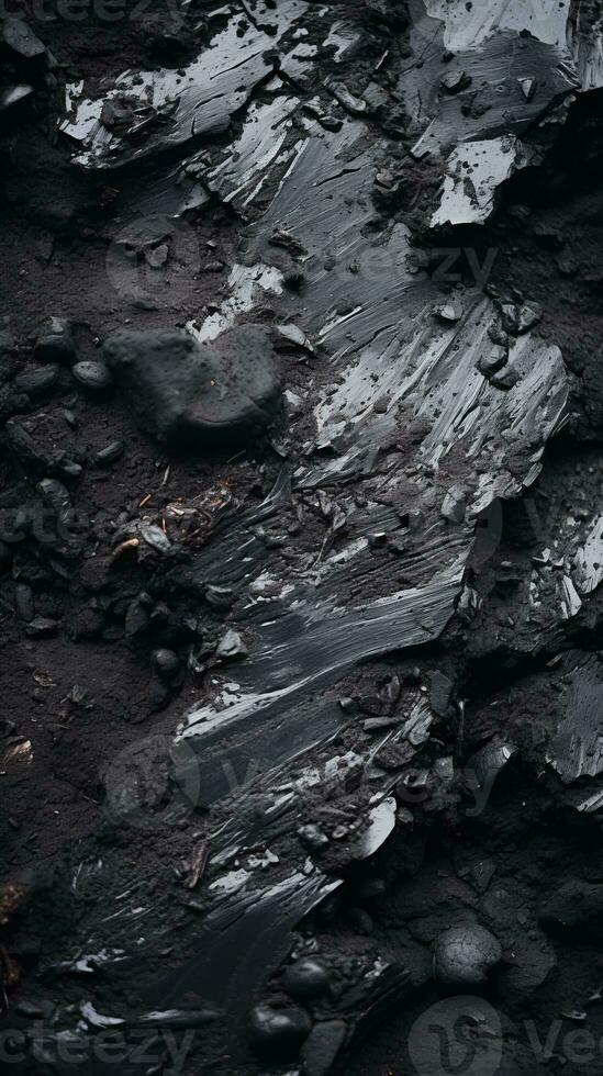 a close up of rocks and dirt with black paint on it generative ai photo
