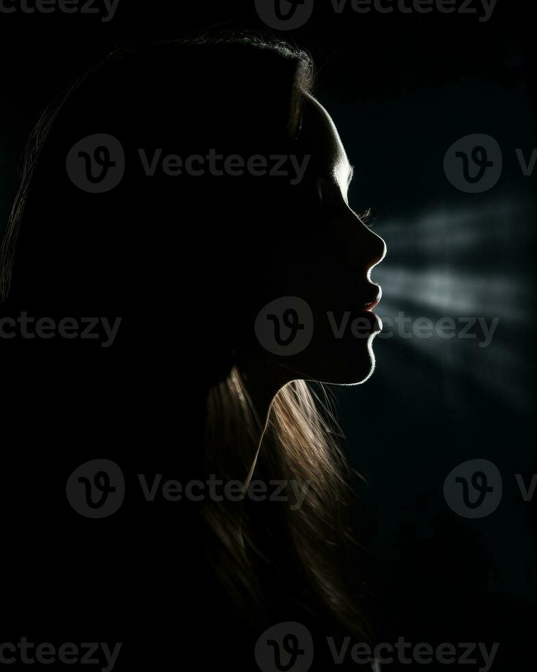 silhouette of a beautiful woman in the dark with light coming from her mouth generative ai photo