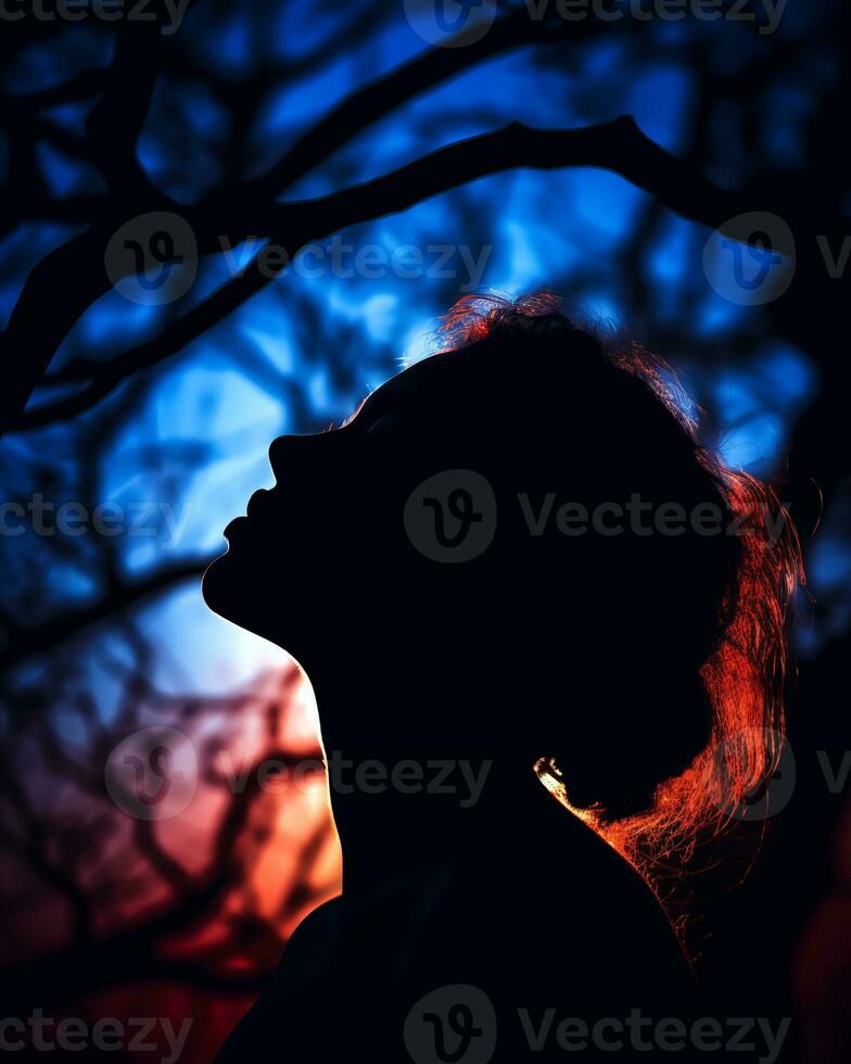 silhouette of a woman in front of a tree at sunset generative ai photo