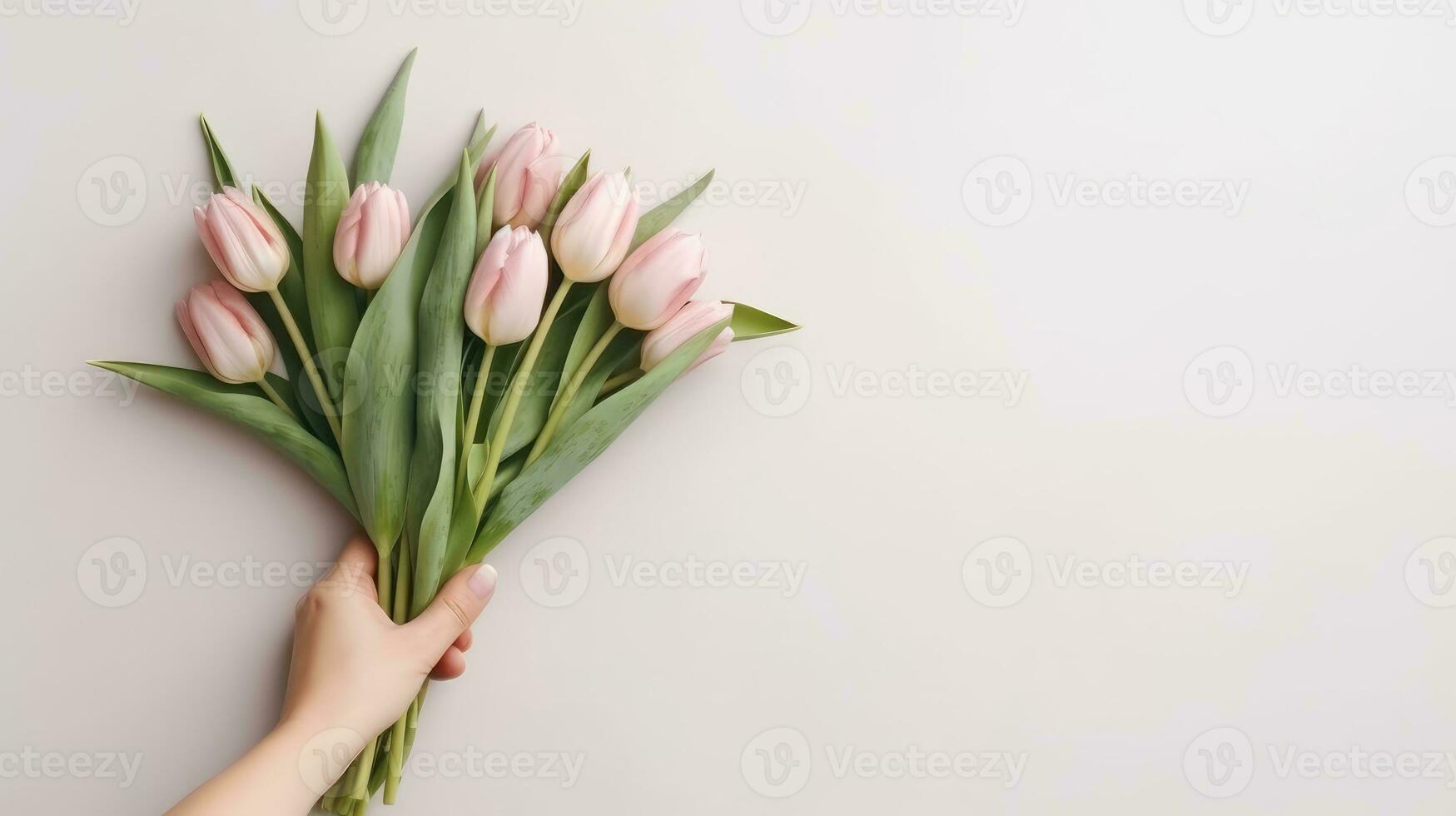 Hand holding a beautiful bouquet of tulip flowers. Isolated on a light wall background. AI Generated photo