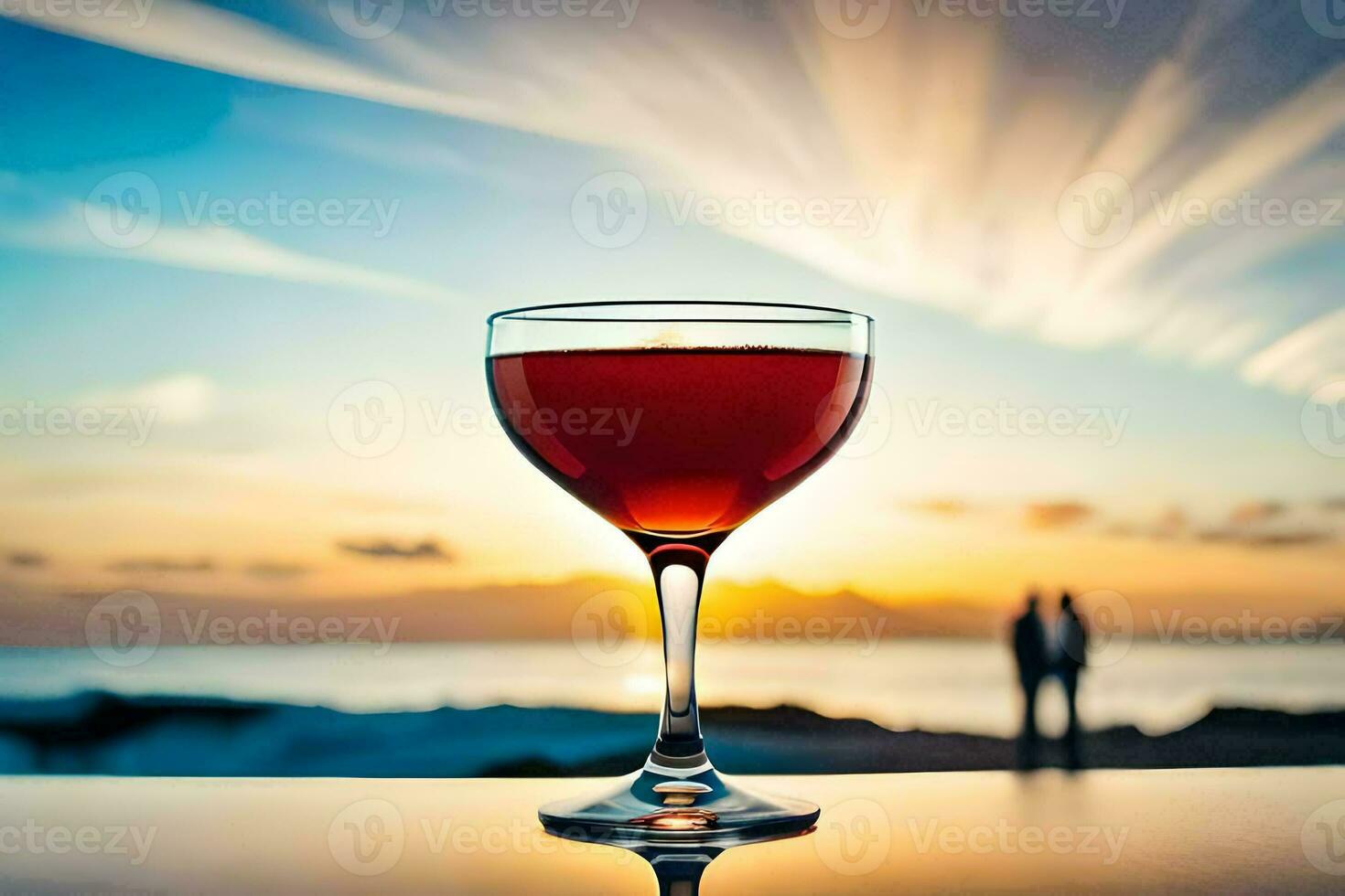 un vaso de rojo vino en un mesa en frente de el océano. generado por ai foto