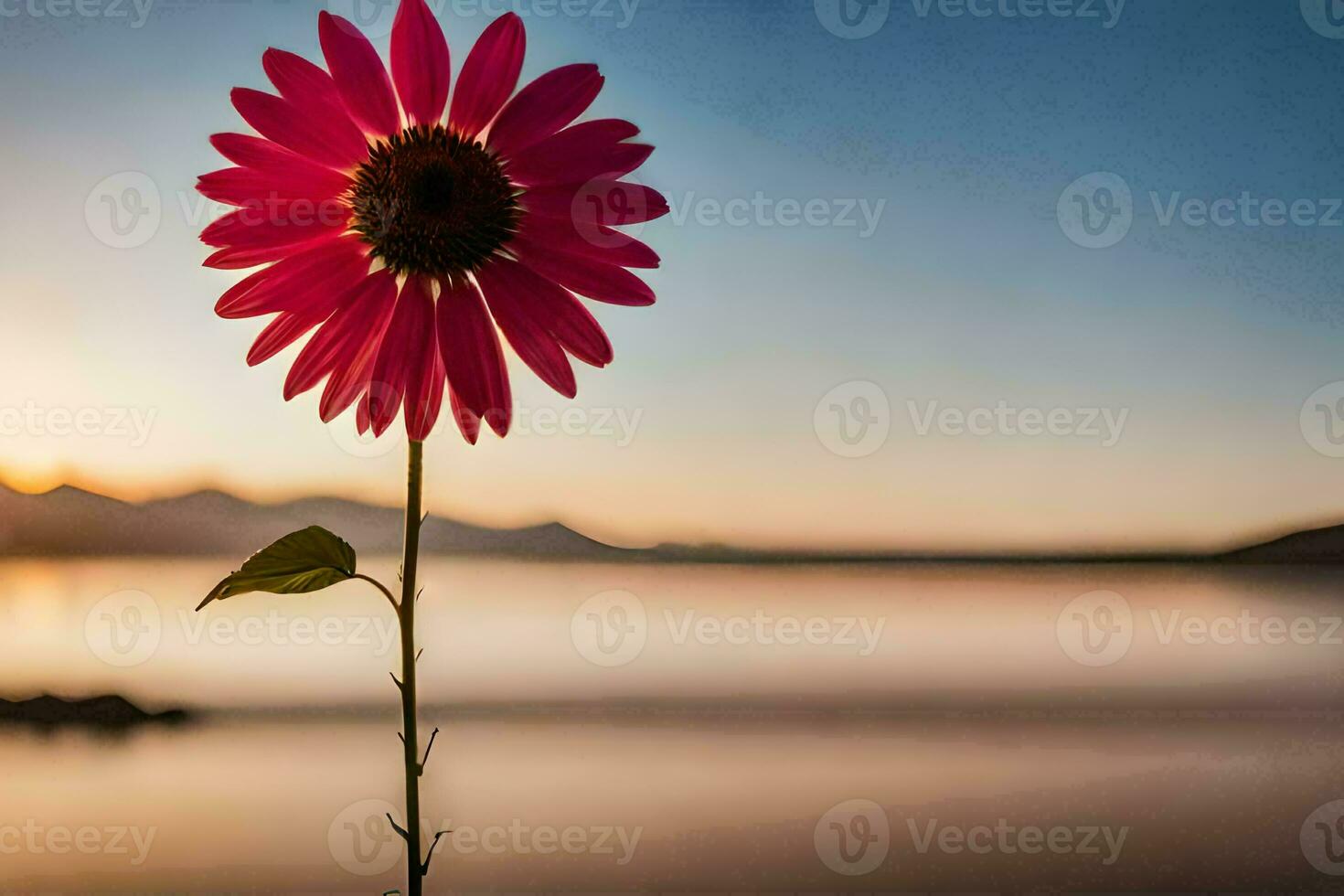 a pink flower stands in front of a lake at sunset. AI-Generated photo