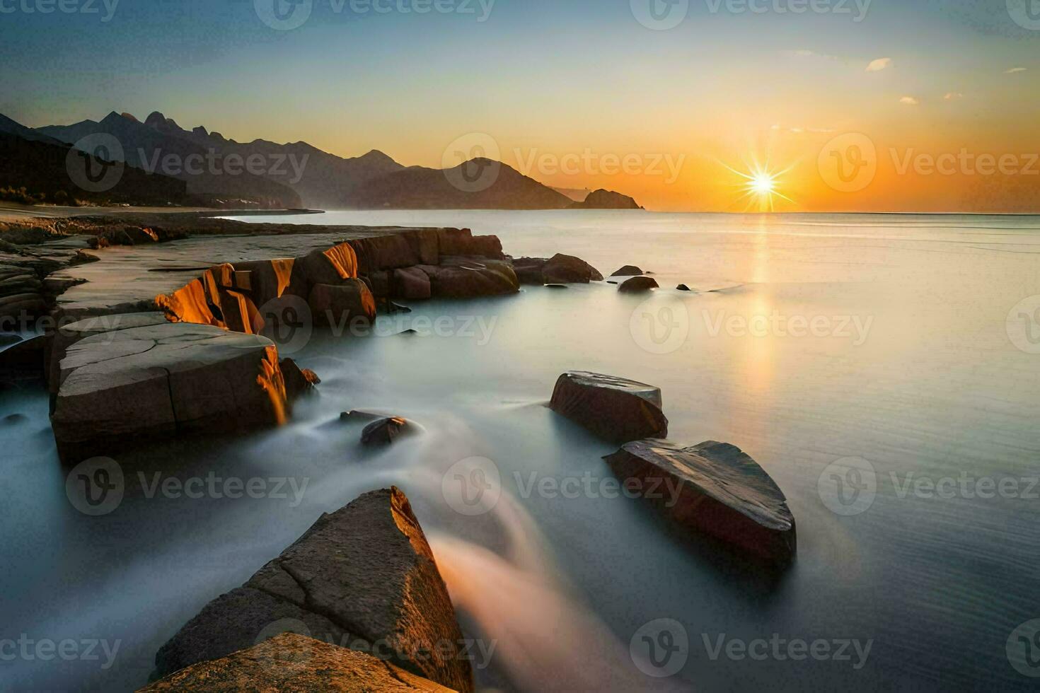 the sun rises over the ocean and rocks in the foreground. AI-Generated photo
