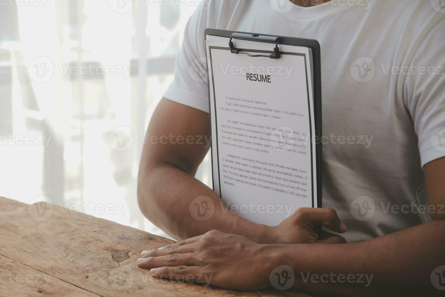 Close up view of job interview in office, focus on resume writing tips, employer reviewing good cv of prepared skilled applicant, recruiter considering application, hr manager making hiring decision photo