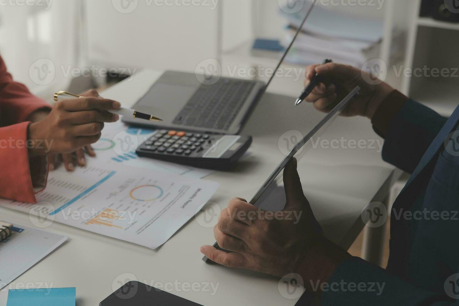 Close up Business woman using calculator and laptop for do math finance on wooden desk, tax, accounting, statistics and analytical research concept photo