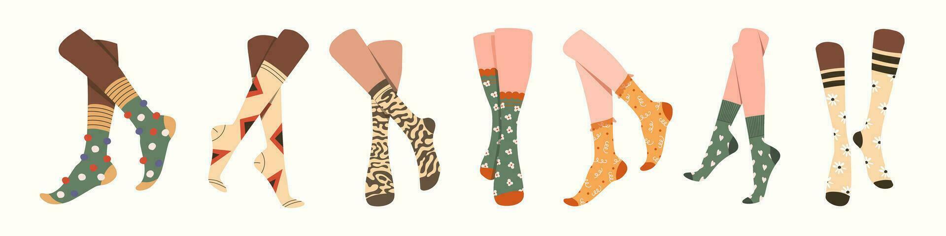 Pairs of feet in socks set. vector