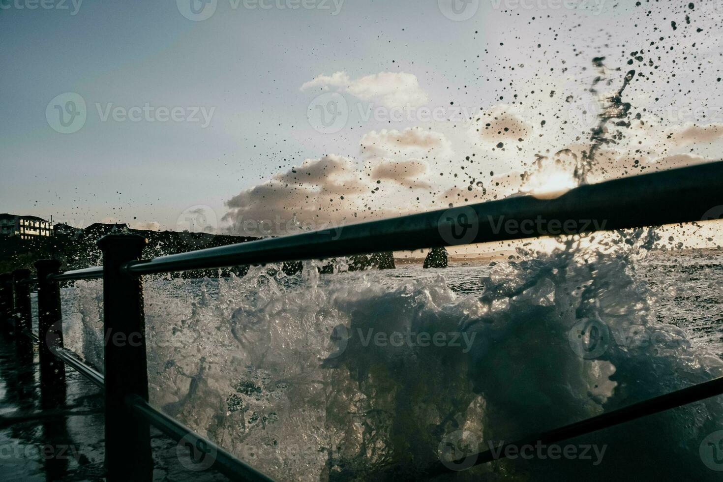 a view of the ocean from a railing photo