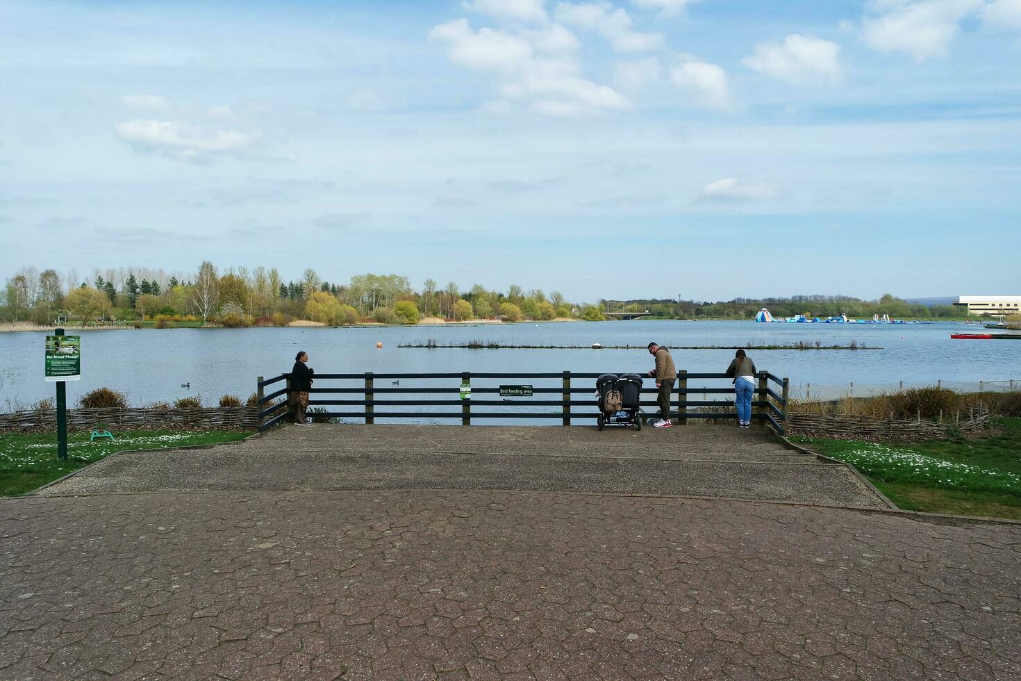 Beautiful view of People Walking and Visiting the Willen Lake of Milton Keynes City of England UK, Image Captured on April 9th, 2023 photo