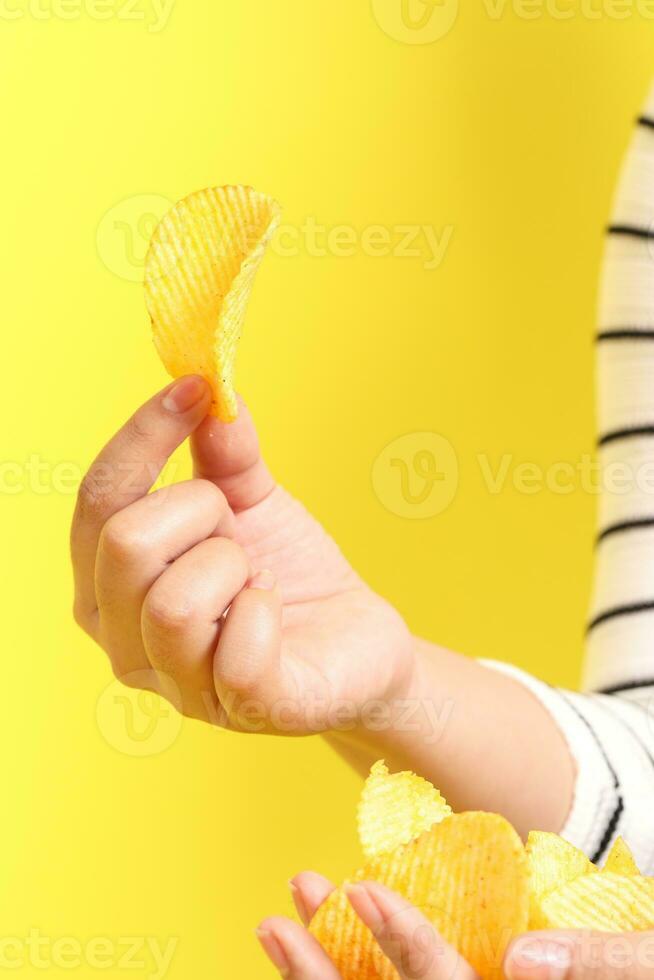 Hand with Potato Chips photo
