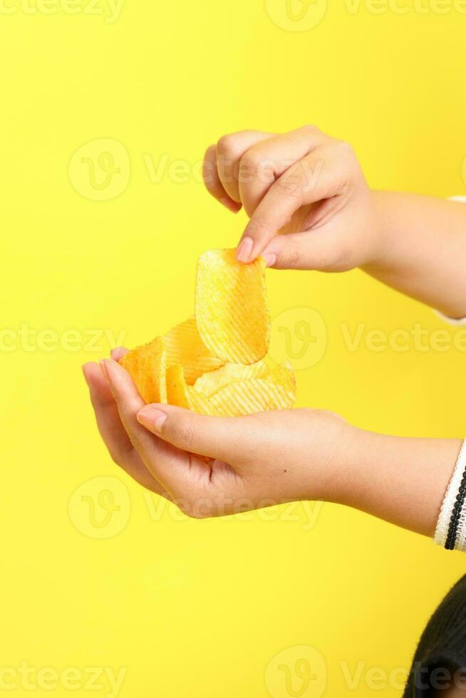 Hand with Potato Chips photo